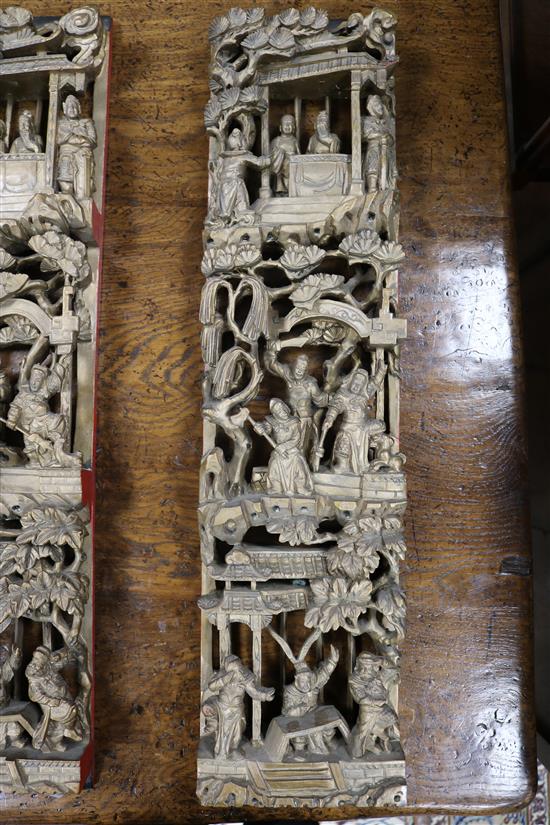 Six Chinese carved giltwood upright panels, soldiers and birds amid foliage